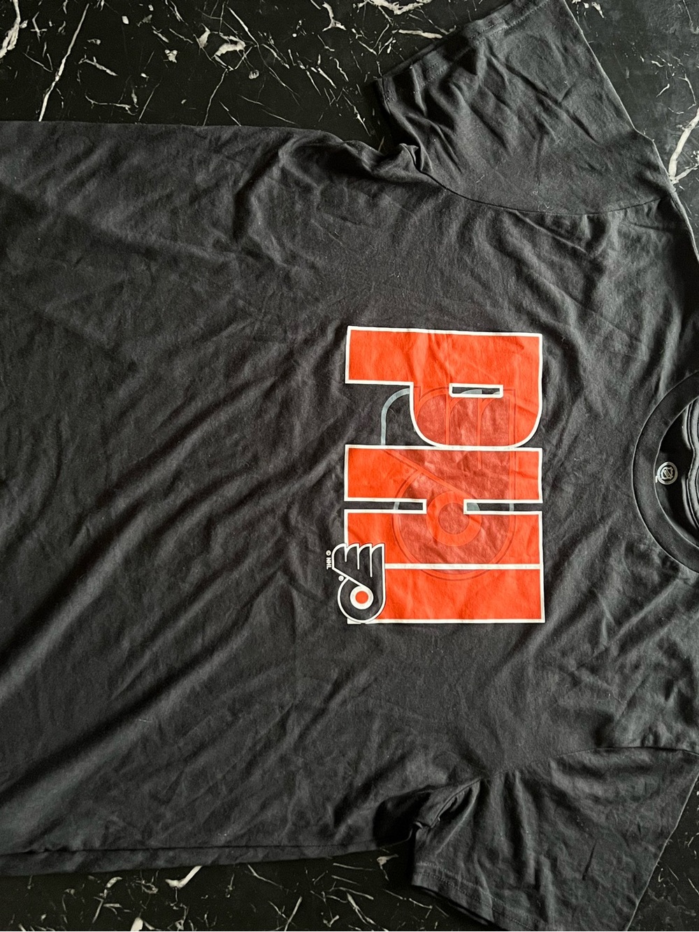NHL Men’s Black Short-Sleeve Tee with Bold Orange PRM Logo